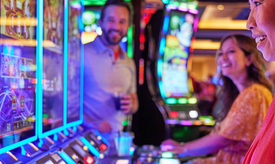 Couple playing slot machines